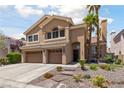 Two-story house boasts a three-car garage, mature landscaping, and stone walkway to the entryway at 2113 Waterbury Ln, Las Vegas, NV 89134