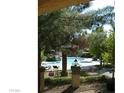 View of the refreshing community pool area, surrounded by lush greenery and offering a tranquil escape for residents at 2200 S Fort Apache Rd # 2062, Las Vegas, NV 89117