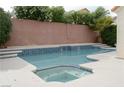 Inviting backyard pool and spa area with blue tile accents, perfect for outdoor relaxation at 2753 Devita Cir, Las Vegas, NV 89117