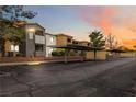 Exterior view of the condo featuring assigned covered parking with well-maintained grounds and landscaping at 3151 Soaring Gulls Dr # 2081, Las Vegas, NV 89128