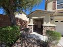 Charming covered front porch with stone accents, offering a welcoming entrance at 32 Focal Point Ave, North Las Vegas, NV 89031