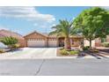 Inviting single-story home featuring a two-car garage, desert landscaping, and a private driveway at 3913 Ricebird Way, North Las Vegas, NV 89084