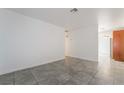 Open-concept living room with tiled floors and neutral walls offering a bright and airy atmosphere at 3925 Torsby Pl, Las Vegas, NV 89119