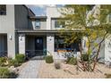 Charming home features a welcoming porch with seating, great for relaxing outdoors at 494 Mahogany Ridge St, Las Vegas, NV 89138