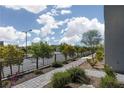 Well-maintained street view featuring sidewalks, street lights, and mature landscaping at 494 Mahogany Ridge St, Las Vegas, NV 89138