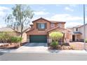Two-story home with desert landscaping, a two-car garage, and an inviting front entrance for potential buyers at 5852 Clear Haven Ln, North Las Vegas, NV 89081