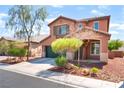 Charming two-story home with well-manicured landscaping, complemented by a covered porch and a two-car garage at 5852 Clear Haven Ln, North Las Vegas, NV 89081