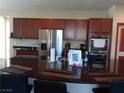 Kitchen featuring a large island with granite countertops and stainless steel appliances at 5852 Clear Haven Ln, North Las Vegas, NV 89081