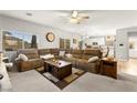 Comfortable living room with a large sectional sofa and bright natural light at 6624 Jade Jaguar St, North Las Vegas, NV 89086