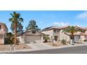 Inviting single-Gathering home with desert landscaping and a spacious two-car garage with desert landscaping at 688 Castlebridge Ave, Las Vegas, NV 89123