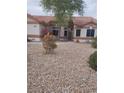 Charming single-story home with desert landscaping, red tile roof, and neutral stucco exterior at 7894 W Patrick Ln, Las Vegas, NV 89113