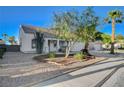 Single-story home with low-maintenance desert landscaping and mature trees at 832 Seco Verde Ave, Henderson, NV 89015