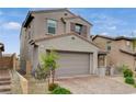 Charming two-story home featuring a neutral color palette, tiled roof, two-car garage, and well-maintained landscaping at 8801 Trotternish Ridge Dr, Las Vegas, NV 89166