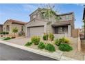 Charming two-story home featuring a neutral color palette, tiled roof, two-car garage, and beautiful landscaping at 8801 Trotternish Ridge Dr, Las Vegas, NV 89166