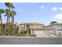 Charming two-story home featuring desert landscaping and a two-car garage at 9404 Low Tide Ct, Las Vegas, NV 89117
