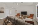 Inviting living room featuring neutral walls, vaulted ceilings, and modern decor at 9552 Gold Bank Dr, Las Vegas, NV 89134