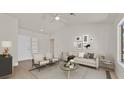 Cozy living room featuring modern decor, neutral colors, and ample natural light at 9552 Gold Bank Dr, Las Vegas, NV 89134