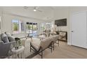 Bright living space with sliding glass doors leading to the outdoor space and backyard at 9552 Gold Bank Dr, Las Vegas, NV 89134