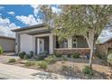 Charming single-story home featuring a two-car garage, covered porch, and mature landscaping at , Henderson, NV 89011