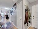 Hallway featuring neutral paint, tile floors, and access to other rooms in the home at 1060 Neil Armstrong Cir, Las Vegas, NV 89145