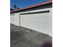 Spacious one-car garage providing ample parking and storage space at 171 Greenbriar Townhouse Way, Las Vegas, NV 89121
