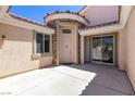 Welcoming front entrance with courtyard, stucco walls, and a covered entryway at 1963 Dakota Lodge Ave, Las Vegas, NV 89123
