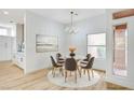 Cozy dining room featuring a round glass table, stylish seating, and bright natural light at 2353 Lauren Dr, Las Vegas, NV 89134