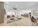Spacious living area with an open layout, featuring modern decor, large windows, and stylish furnishings at 2353 Lauren Dr, Las Vegas, NV 89134