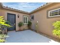 Private courtyard with sleek door and stucco walls providing an intimate outdoor space at 2673 Paris Amour St, Henderson, NV 89044