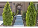 Close-up of the front entrance, showcasing the detailed gate and landscaped pathway at 2673 Paris Amour St, Henderson, NV 89044