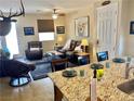 Inviting living area featuring an open floor plan and stylish decor that connects the kitchen to the main living space at 2719 Chinaberry Hill St, Laughlin, NV 89029