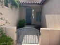 Inviting front entryway with a secure gated entry at 2855 Grande Valley Dr, Las Vegas, NV 89135