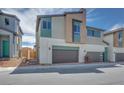 Modern townhome showcasing contemporary architecture, neutral color palettes, and a convenient two-car garage at 3357 Via Tizzoni St, Henderson, NV 89044