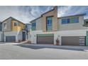 Modern townhome showcasing contemporary architecture, neutral color palettes, and a convenient two-car garage at 3357 Via Tizzoni St, Henderson, NV 89044