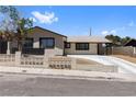 Charming single-story home with a well-maintained front yard and concrete driveway at 4450 San Rafael Ave, Las Vegas, NV 89120