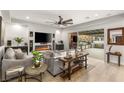 Modern living room featuring a fireplace, large TV, comfortable seating, and access to the outdoor space at 4505 Amazing View St, Las Vegas, NV 89129