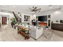 Inviting living room with a staircase, fireplace, entertainment center, and stylish decor at 4505 Amazing View St, Las Vegas, NV 89129