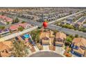 An elevated view shows a tile-roofed neighborhood with manicured lawns at 4548 Switchback St, North Las Vegas, NV 89031