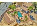 Aerial view of a backyard featuring a pool with a hot tub and lush landscaping at 4548 Switchback St, North Las Vegas, NV 89031