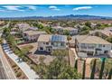 Backyard aerial view of a two-story stucco home with solar panels and mature landscaping at 4804 Laurentia Ave, Las Vegas, NV 89141