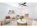 Bright living room with neutral tones, a ceiling fan, and an open floor plan at 50 Armstrong Cir, Henderson, NV 89015