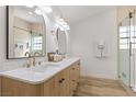 Elegant bathroom with double vanities, marble countertop, and glass enclosed shower at 5000 Linkside Dr, Las Vegas, NV 89130