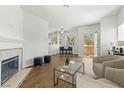 Inviting living area with fireplace, comfortable seating, and dining nook nearby at 5250 S Rainbow Blvd # 2106, Las Vegas, NV 89118