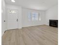 Bright living room features new flooring, fresh paint, a fireplace, and plenty of natural light at 540 Kelsford Dr, Las Vegas, NV 89123