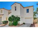 Two-story home featuring a stucco exterior, an attached garage, and drought-resistant landscaping at 6271 Sunset Spring Ave, Las Vegas, NV 89122