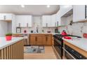 Well-equipped kitchen featuring stainless steel appliances, white countertops, and stylish cabinetry at 6324 Eugene Ave, Las Vegas, NV 89108