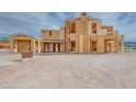 An exterior shot reveals the framing of this modern home's design and large window placements at 65 Bellissima Lago Ct, Henderson, NV 89011