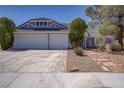 Two-story home featuring a two-car garage and desert landscaping at 6773 Obannon Dr, Las Vegas, NV 89146
