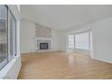 Bright living room features a fireplace and hardwood floors at 6773 Obannon Dr, Las Vegas, NV 89146