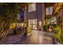 Outdoor living space boasts a stone fountain, comfortable seating and convenient access to the house at 7940 Castle Pines Ave, Las Vegas, NV 89113